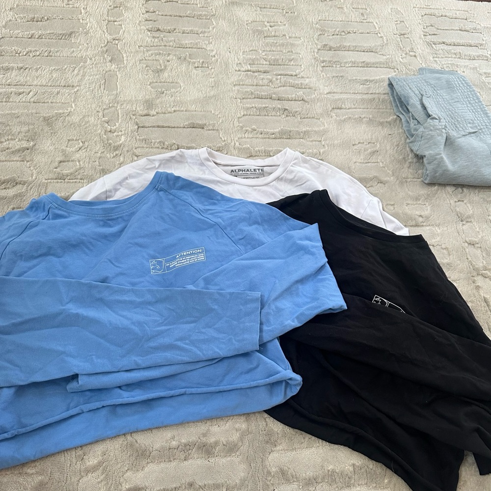 Alphalete Trio: Blue, White, and Black Long Sleeves